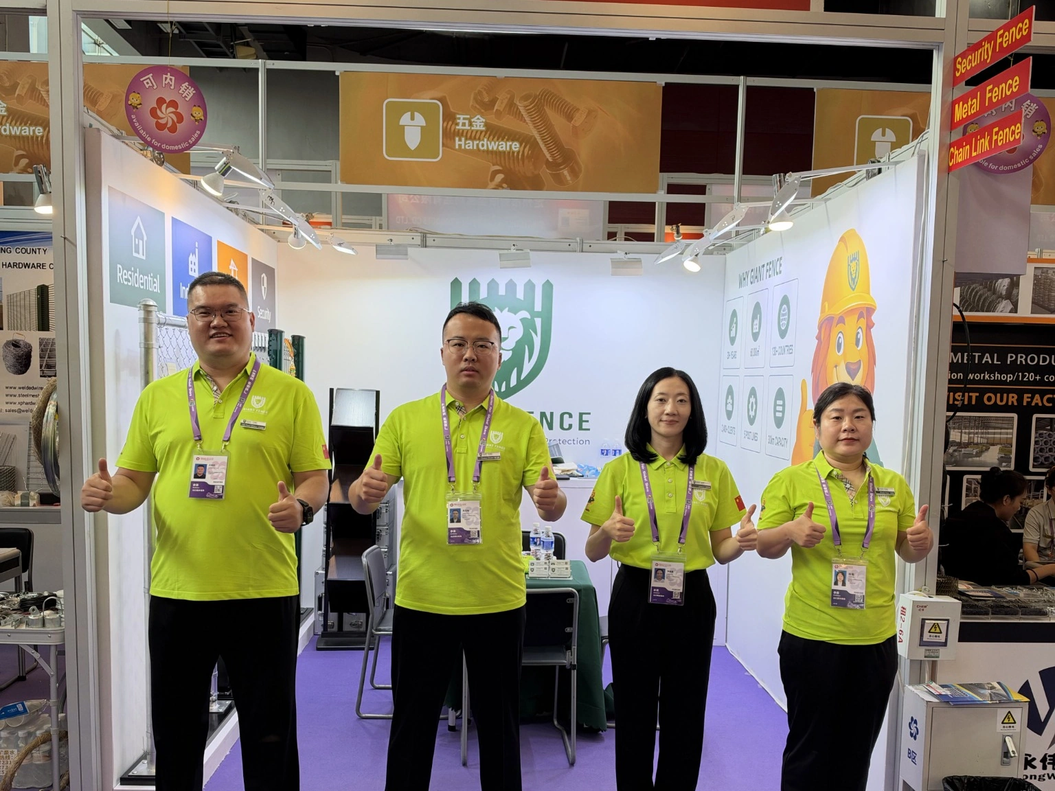 Four team members in green uniforms at the 140th Canton Fair.
