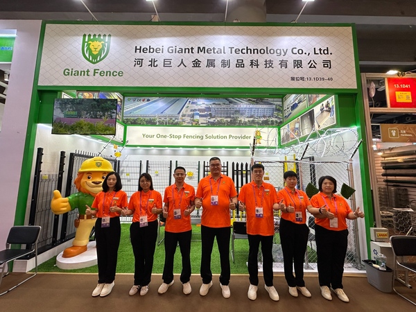 Hebei Giant Metal team at 140th Canton Fair booth, showing metal fencing products.