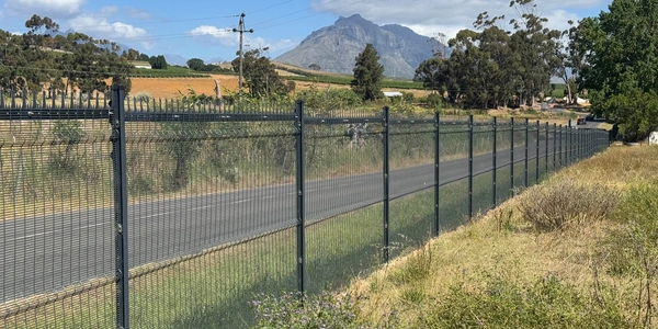 358 security fence with I posts and spikes along a wine farm perimeter.