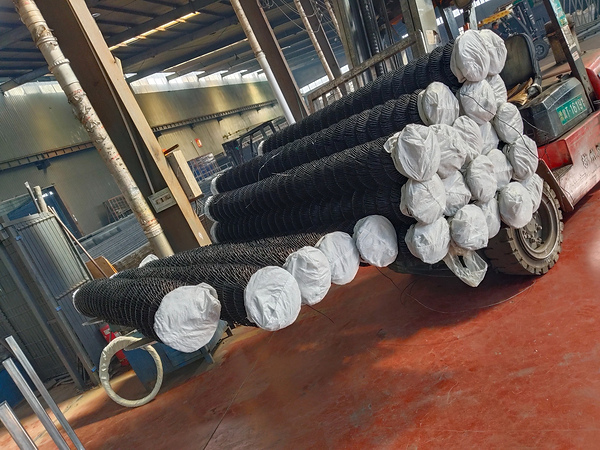  Rolls of chain link fence are loaded on forklift for delivery from factory.