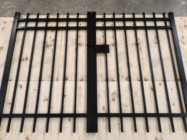 Latch and lock hardware fitted on black steel tubular double fence gate.