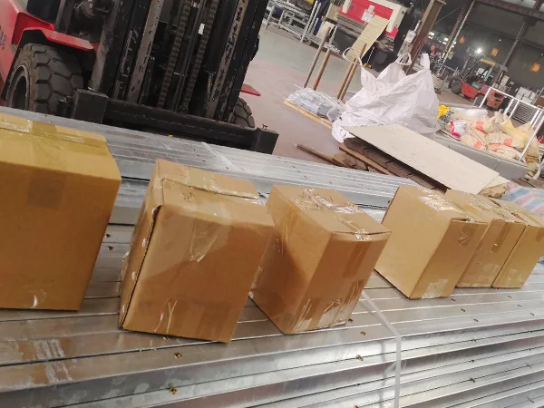 Several cartons of 3D fence accessories in the container.