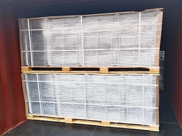 Several wooden pallets of 3D fence panels in the container.