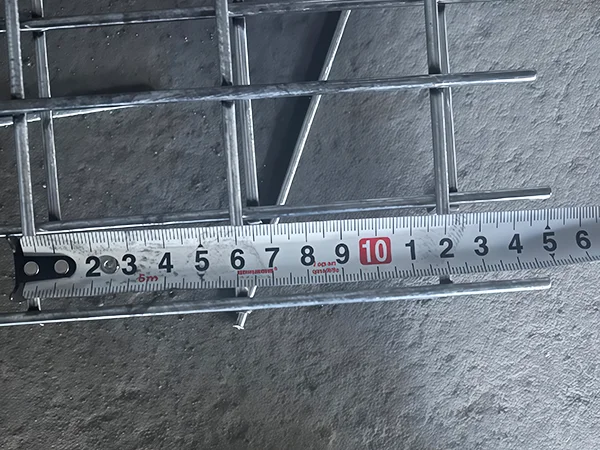 A QC worker is measuring the mesh size of 3D fence.