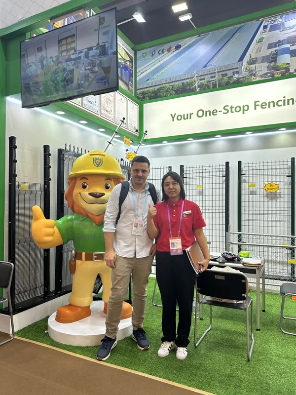 The sales representative is taking photo with customer at the booth.