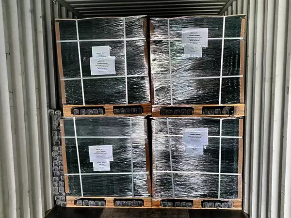 Several wooden pallets of airport fence panels in the container.