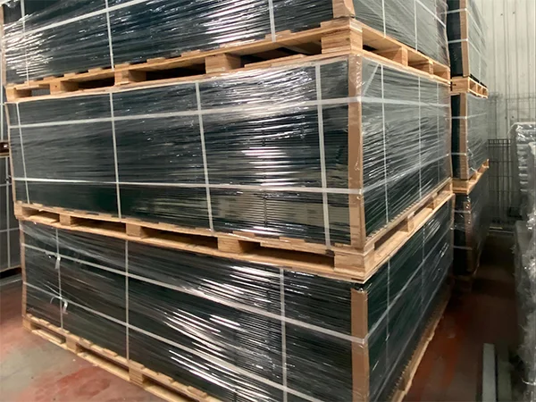 Several wooden pallets of 2D fence in the warehouse.