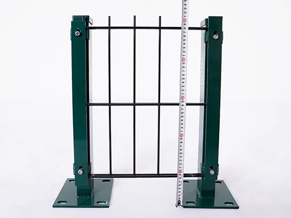 A QC worker is measuring the height of 2D fence.