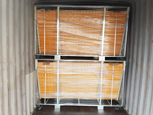 Two metal pallets of edge protection fences in the container.