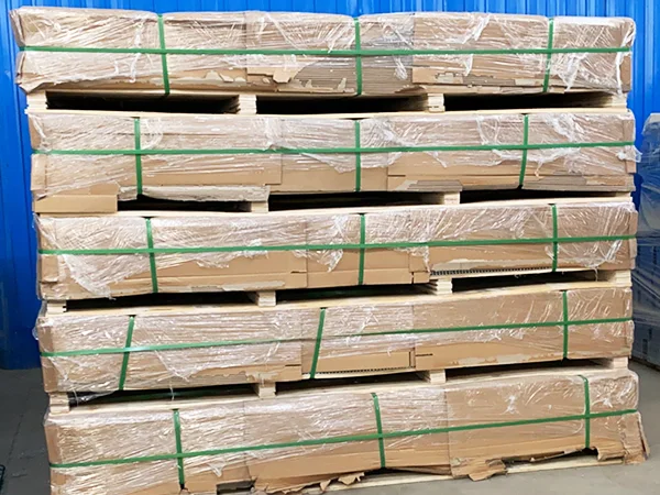 Several wooden pallets of 358 high security fences in the warehouse.