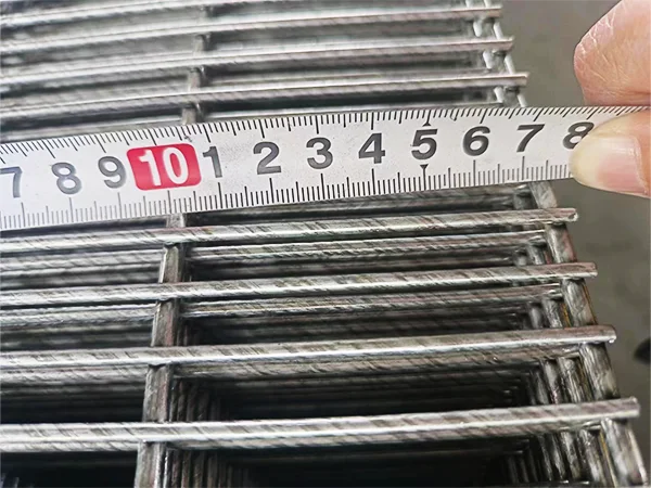 A QC worker is measuring the mesh size of 358 high security fence.