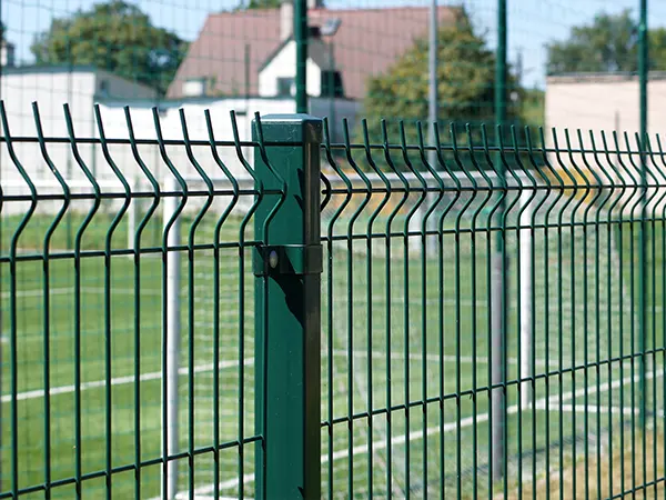 The green 3D security fences are surrounding the football court.
