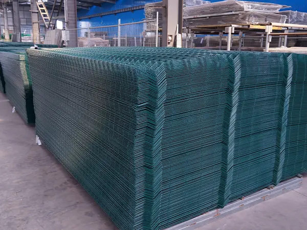 Several pieces of green 3D fences on the ground.