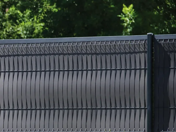 3D privacy fence panel with dark gray privacy slats.