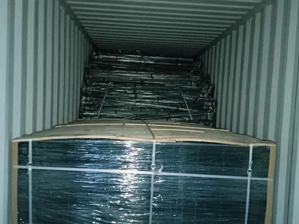 Packed 3D welded mesh fence bundles loaded inside shipping container