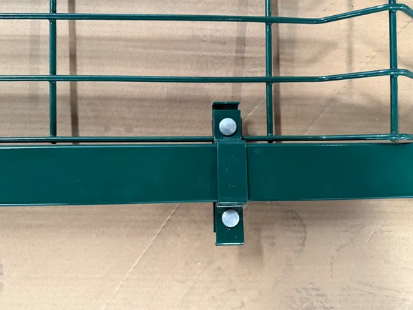 Detail shot of clamp fastener for green 3D welded mesh fence