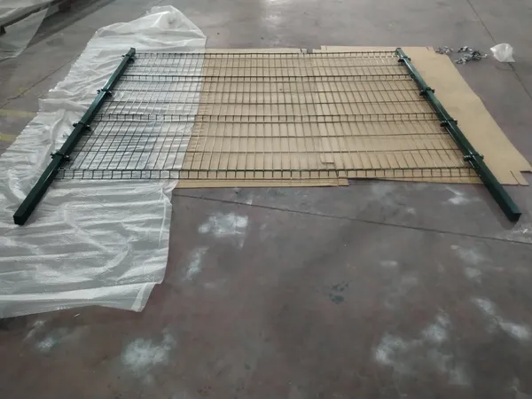 Full panel green 3D welded mesh fence laid out on workshop floor