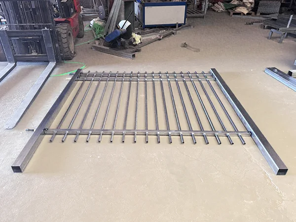 A steel tubular fence on the ground.