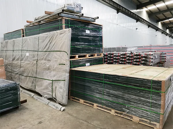 Several wooden pallets of airport fences in the warehouse.