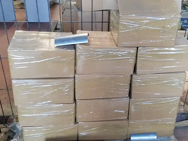 Several cartons of fence clamps in the warehouse.