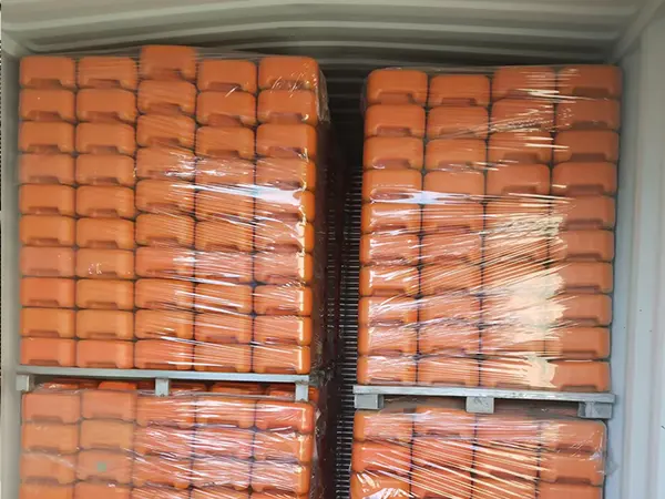 Several metal pallets of Australia temporary fencing feet in the container.