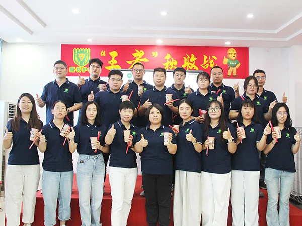 All sales representatives holding a cup of milk tea.