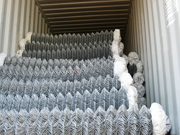 Several rolls of chain link fences in the container.