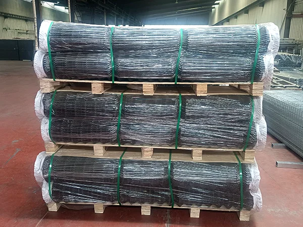 Three wooden pallets of chain link fences.