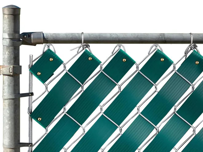 Chain link fence showing the privacy slat fastening method.