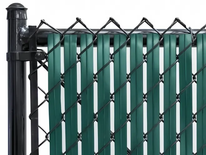 Chain link fence with privacy slat installation.