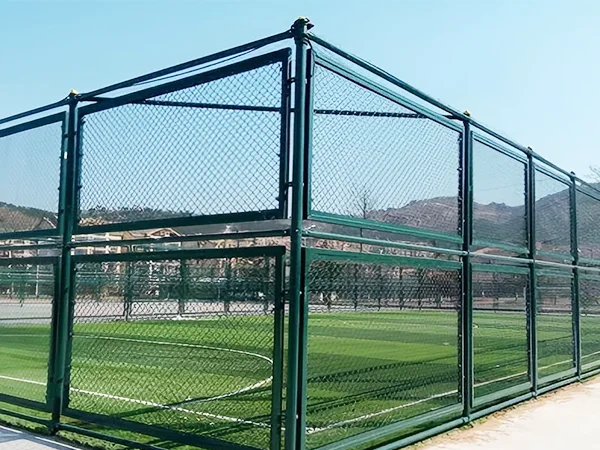 The chain link sports fences are installed in the gym.