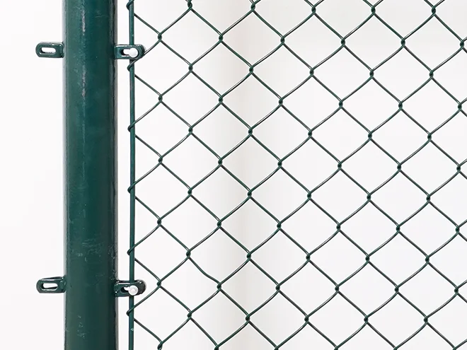 A round post mesh detail of chain link sports fence.