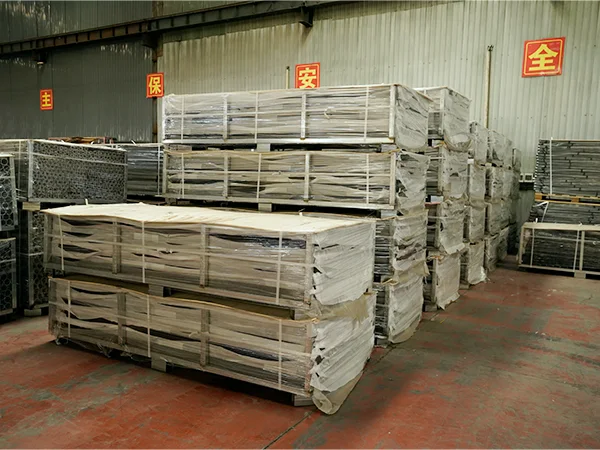 Several metal pallets of posts in the warehouse.