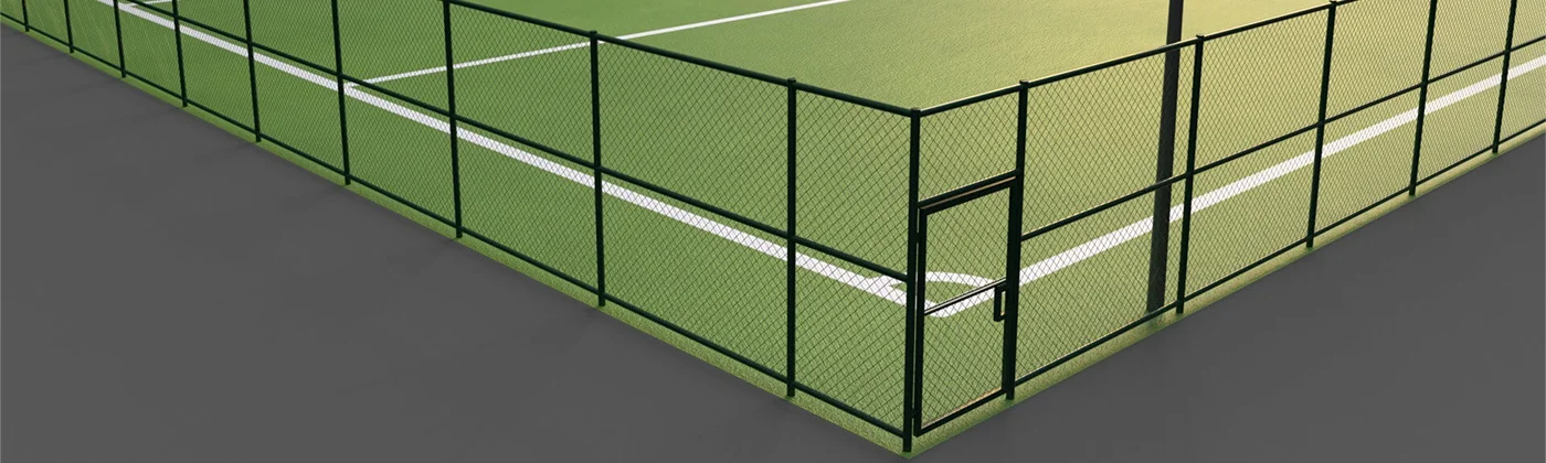 A line of galvanized chain link fence with single barb arm.