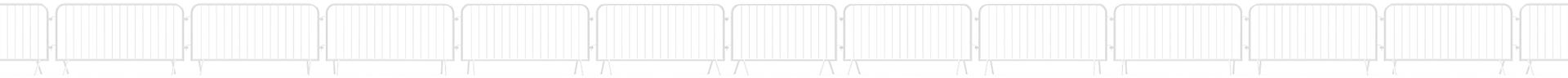 A line of crowd control barriers.