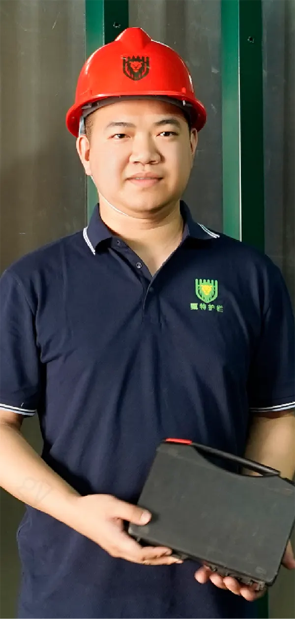 A QC worker is standing beside of the square post powder coating line with smile.