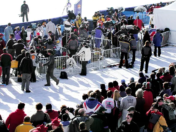 The crowd control barriers are separate peoples at the concert.