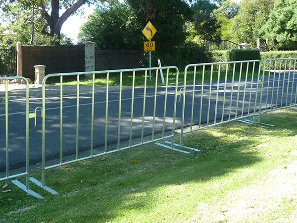 The crowd control barriers are placed on the grassland.