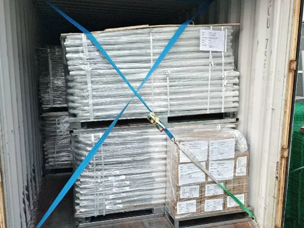 Custom chain link gates are loaded into shipping