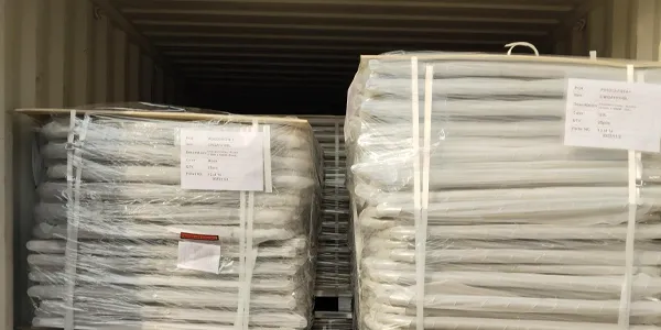 Two stacks of customized chain link gates, packaged with plastic film and straps, are stacked inside a container