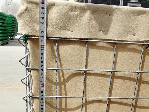 A QC worker is measuring the height of defensive barriers.