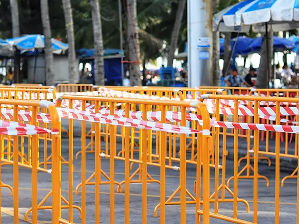 The yellow crowd control barriers are placed on the event site.