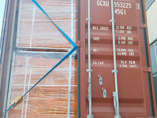 Edge protection fence loaded and secured inside container.