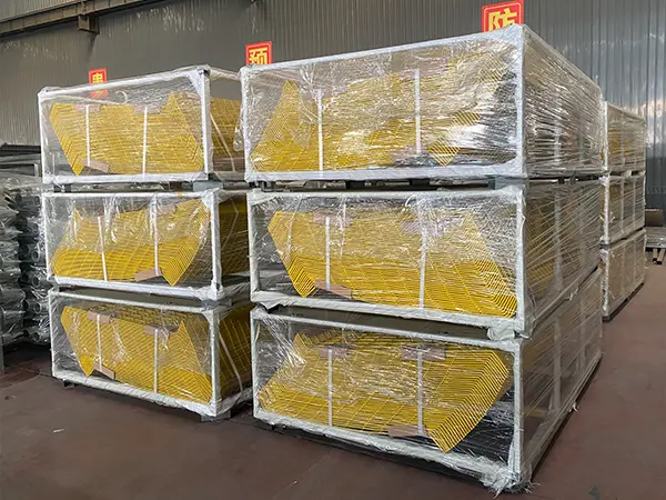 Several metal pallets of edge protection fence panels.