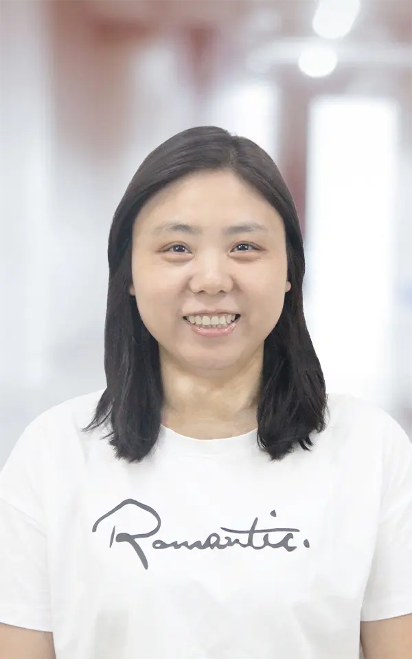 A woman employee is smiling.