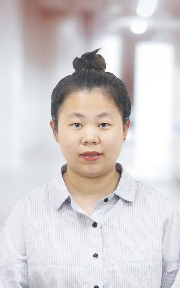 A woman employee is smiling.