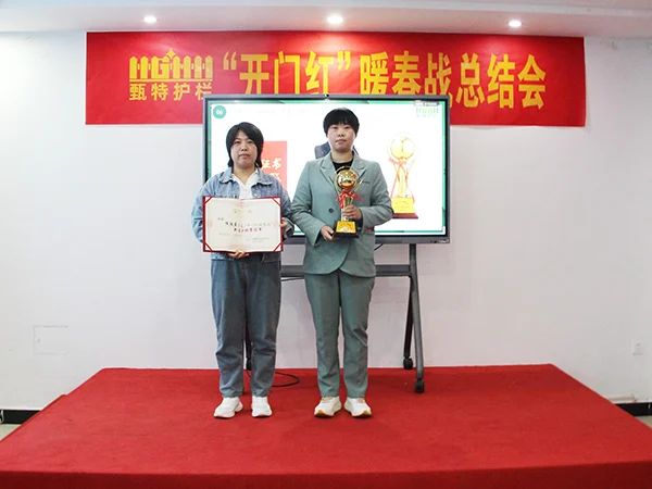 Two sales managers are awarded certificate and trophy.