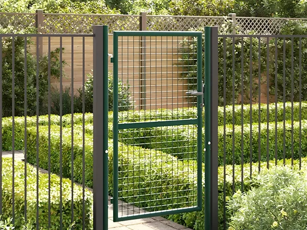 The garden fence gate is installed in the garden.