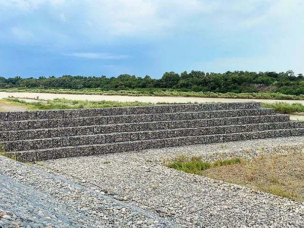 The woven gabion retaining walls are installed as a dam.