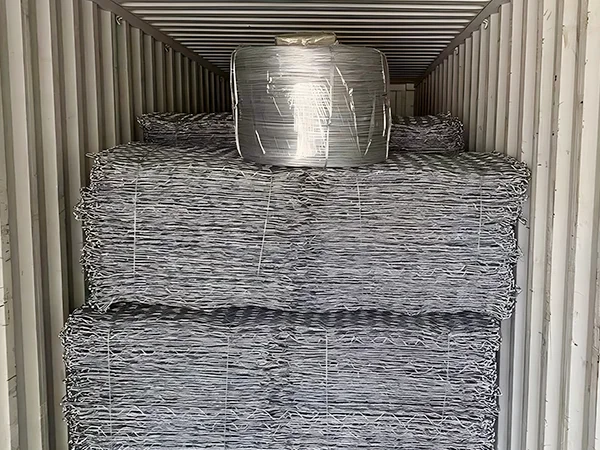 Several bundles of woven gabion retaining walls in the container.